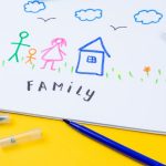 Home, love, family, still life concept. felt-tip pen lying on a paper with children's drawing family. Selective focus, copy space background